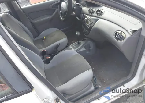 2004 Ford Focus Lx z USA, uszkodzony, nr VIN 1FAFP33P44W195187